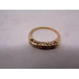 A 9ct gold half eternity diamond ring