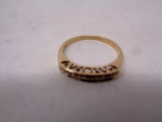 A 9ct gold half eternity diamond ring