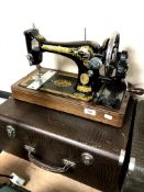 A 20th century Singer hand sewing machine in case