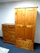 A pine double door wardrobe fitted two drawers beneath, width 90 cm,