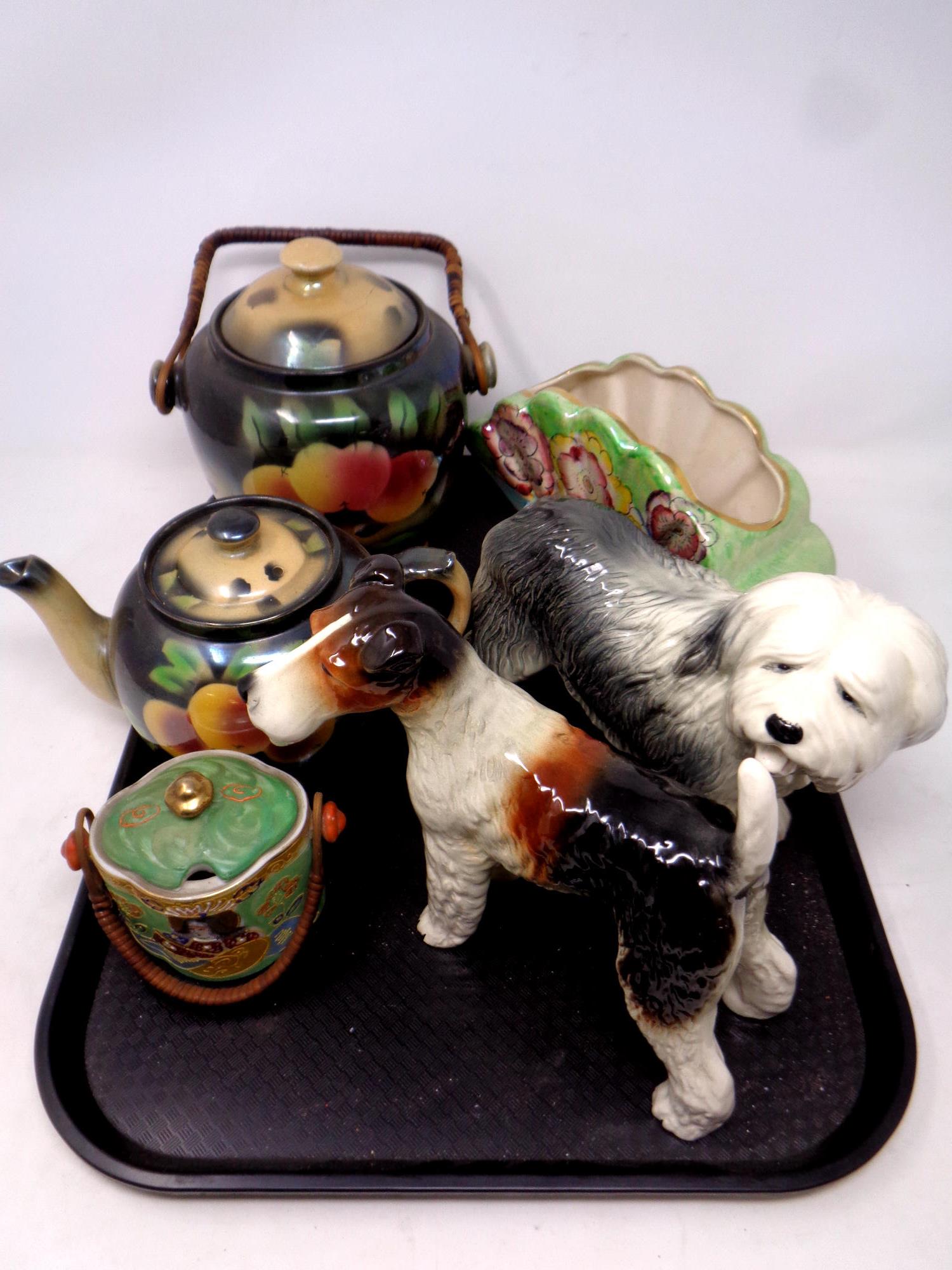 A tray containing assorted ceramics to include Cooper Craft dogs, Arthur Wood Art Deco vase,