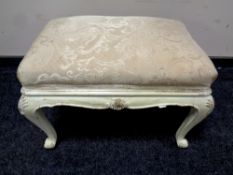 A French shabby chic dressing table stool on cabriole legs