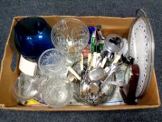 A box containing assorted glassware, stainless steel and plated cutlery,