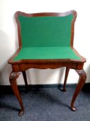 A mahogany shaped turnover top card table on cabriole legs