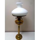 A Duplex brass oil lamp with opaque glass shade and chimney