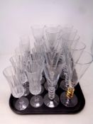 A tray containing glassware to include champagne flutes and wine glasses