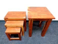 A sheesham wood occasional table together with matching nest of three tables