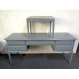 A Stag Minstrel five drawer dressing table with stool, painted,