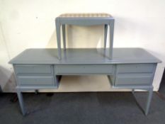 A Stag Minstrel five drawer dressing table with stool, painted,