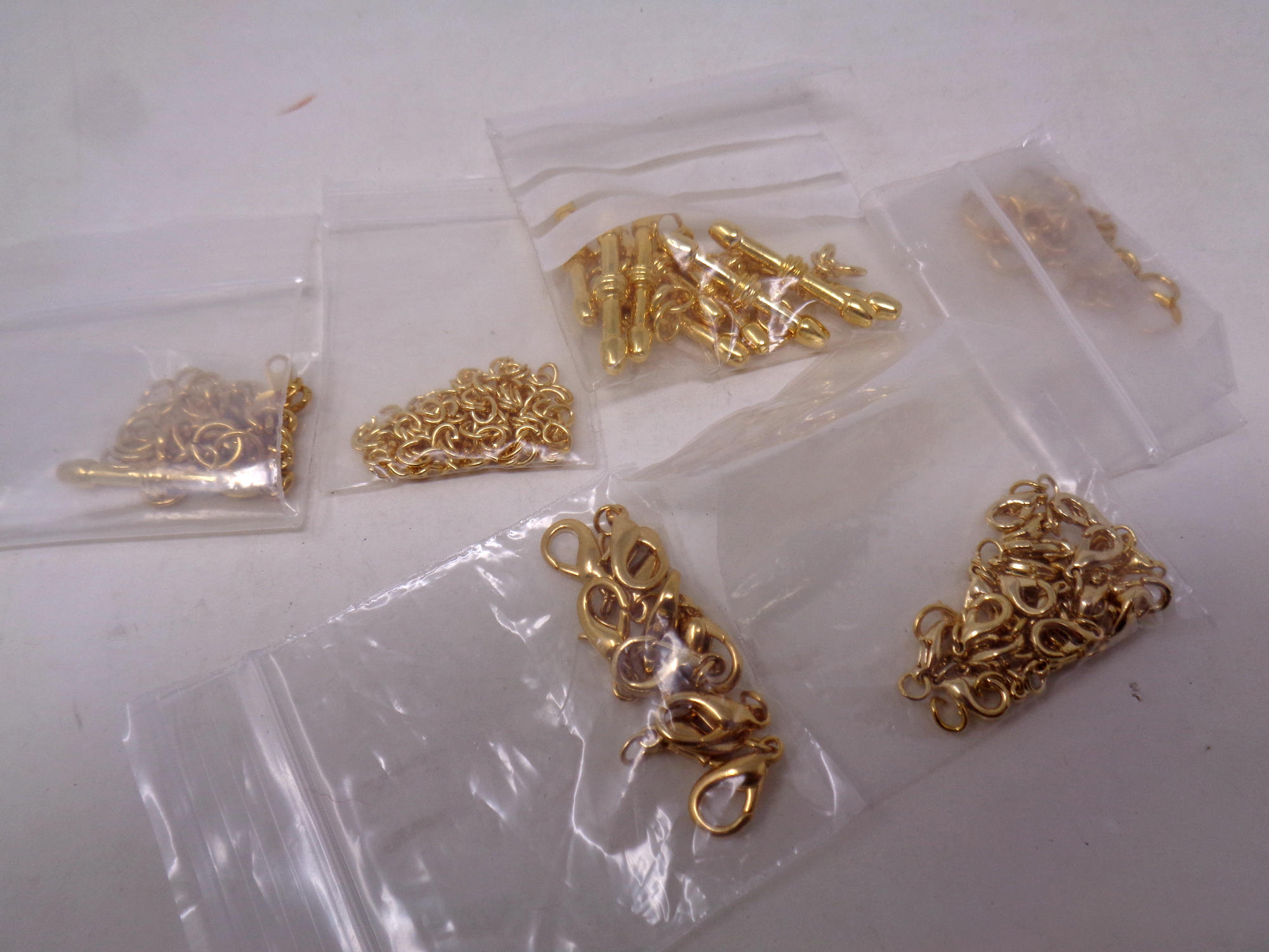 A quantity of gold plated jeweller's findings