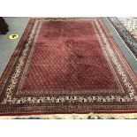 An Indian carpet of Persian Serabend design,