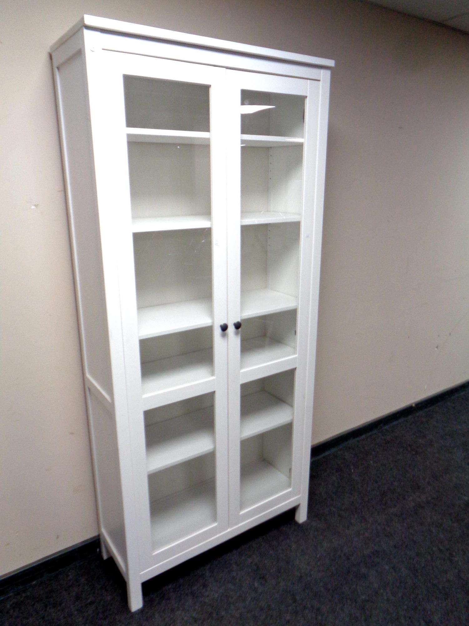 An Ikea pine double door bookcase