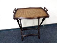 A bamboo and wicker butler's tray on stand