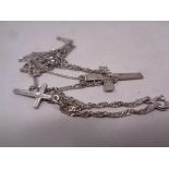 Two silver crosses on chains