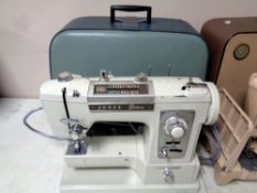 A 20th century Jones Deluxe electric sewing machine in case