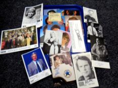 A tray containing assorted signed pictures and photographs to include Kevin Keegan, Michael Aspel,