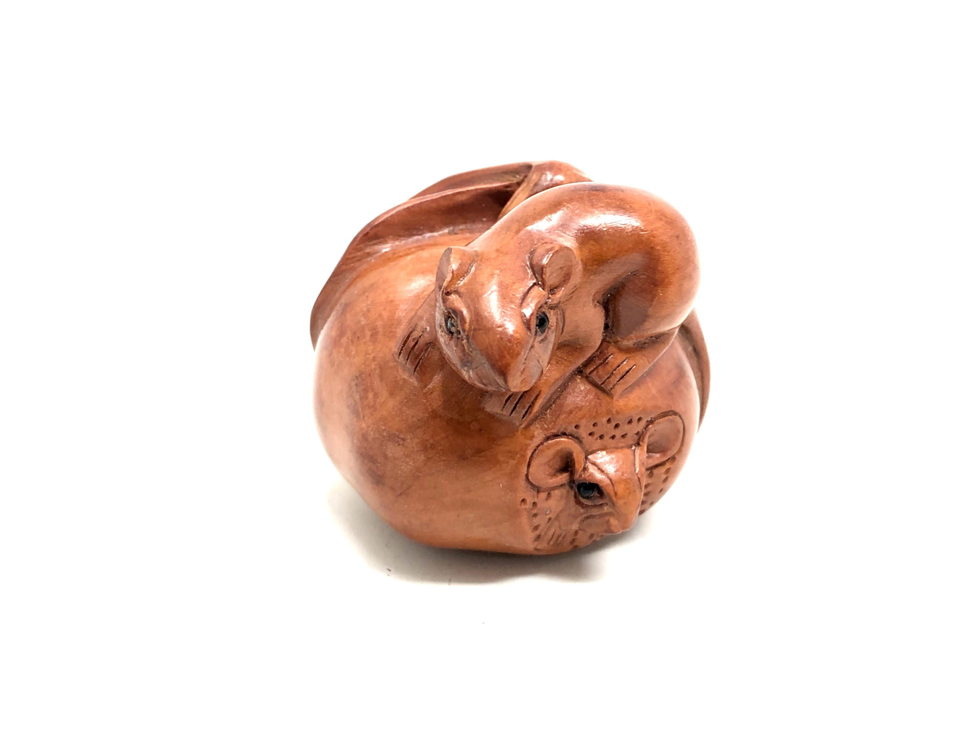 A Japanese carved fruitwood netsuke - Rats on a pumpkin.