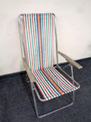 A 20th century folding tubular metal deck chair