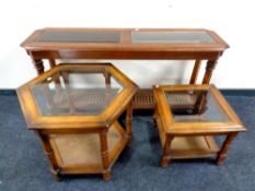 A colonial style two tier hall table with two glass inset panels, length 136 cm,