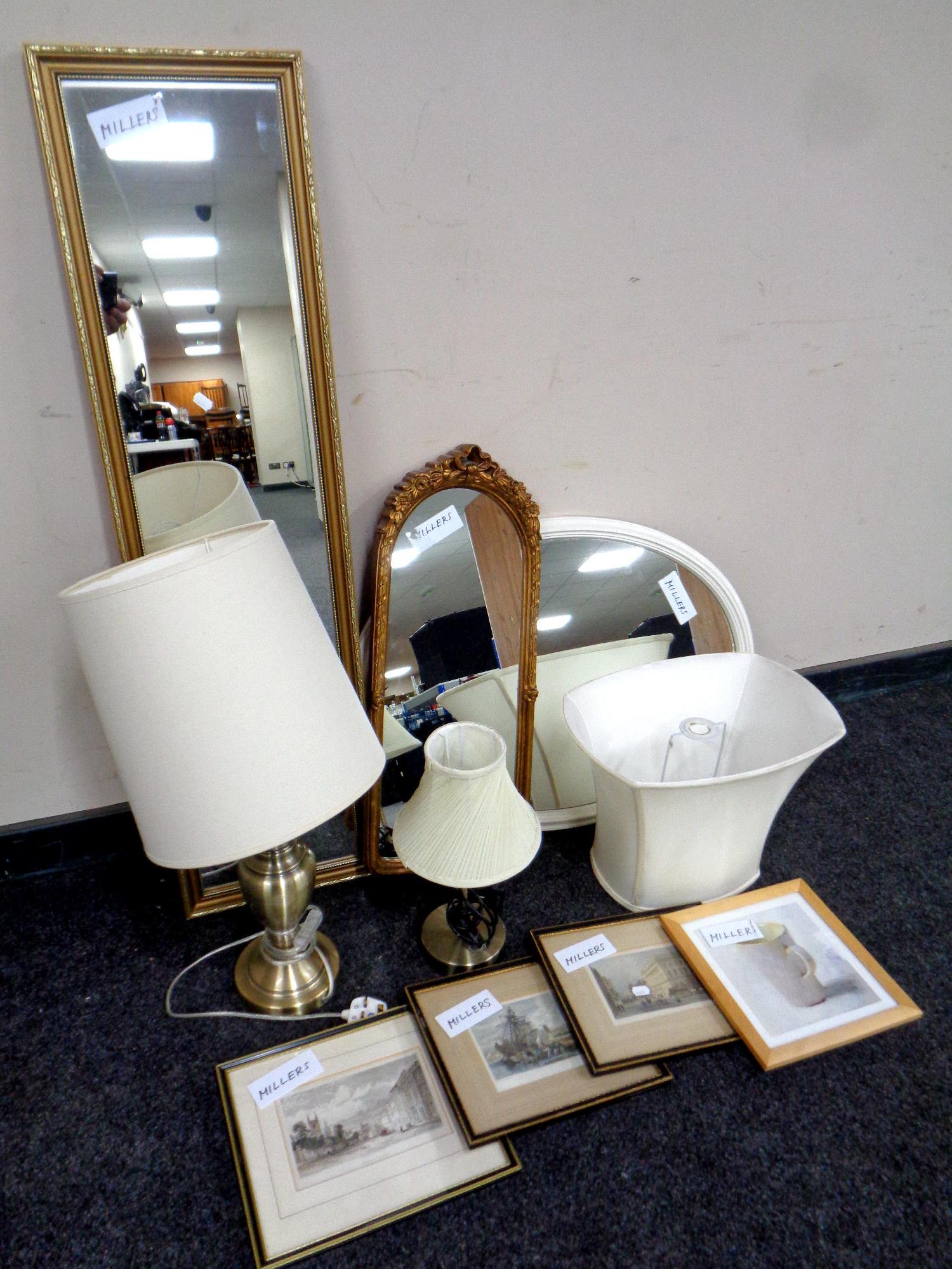 A box containing assorted framed mirrors, prints,