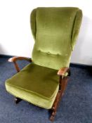 A mid 20th century rocking chair upholstered in a green dralon