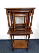 An oak barley twist occasional table together with a nest of three oak tables