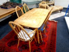 An Ercol elm and beech dining table, length 150 cm,