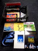 A crate containing theatre and music tour programmes to include Abba, Elton John, Starlight Express,