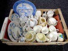 A crate containing a quantity of assorted bone china sugar basins and milk jugs to include Paragon,