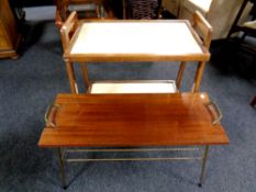 A 20th century two tier tea trolley together with a teak topped coffee table on metal legs