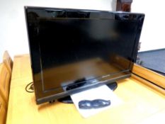 A Neon 32'' LCD TV with remote