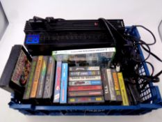 A crate containing Play Station III with leads and controller together with a small quantity of