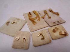 Six pairs of gold plated earrings