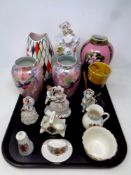 A tray containing assorted ceramics to include Maling harlequin vase, continental figures,