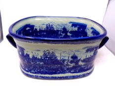 An ironstone blue and white twin handled foot bath