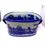 An ironstone blue and white twin handled foot bath