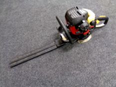 A Homelite Mightylite petrol hedge trimmer