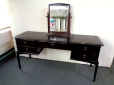 A Stag Minstrel five drawer dressing table with mirror