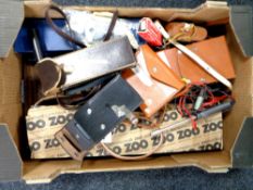 A box containing a quantity of vintage surveyor's equipment