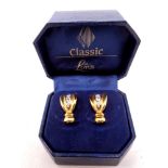 A pair of Lotus gold plated earrings