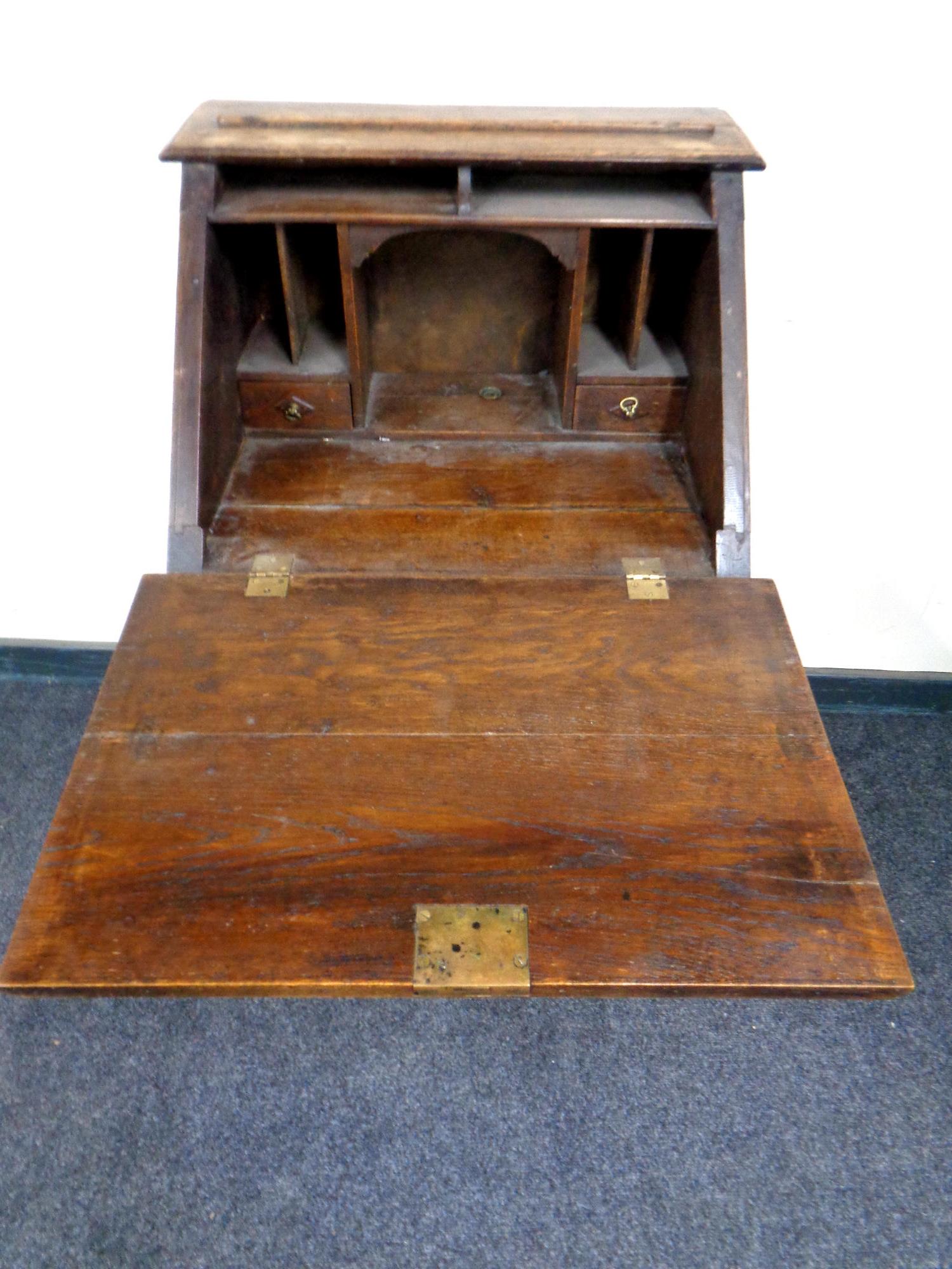 An Edwardian oak lady's bureau fitted two drawers beneath on raised legs, - Image 2 of 2