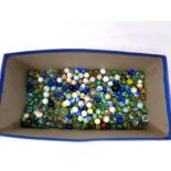 A box containing a large quantity of vintage glass marbles