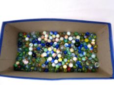 A box containing a large quantity of vintage glass marbles