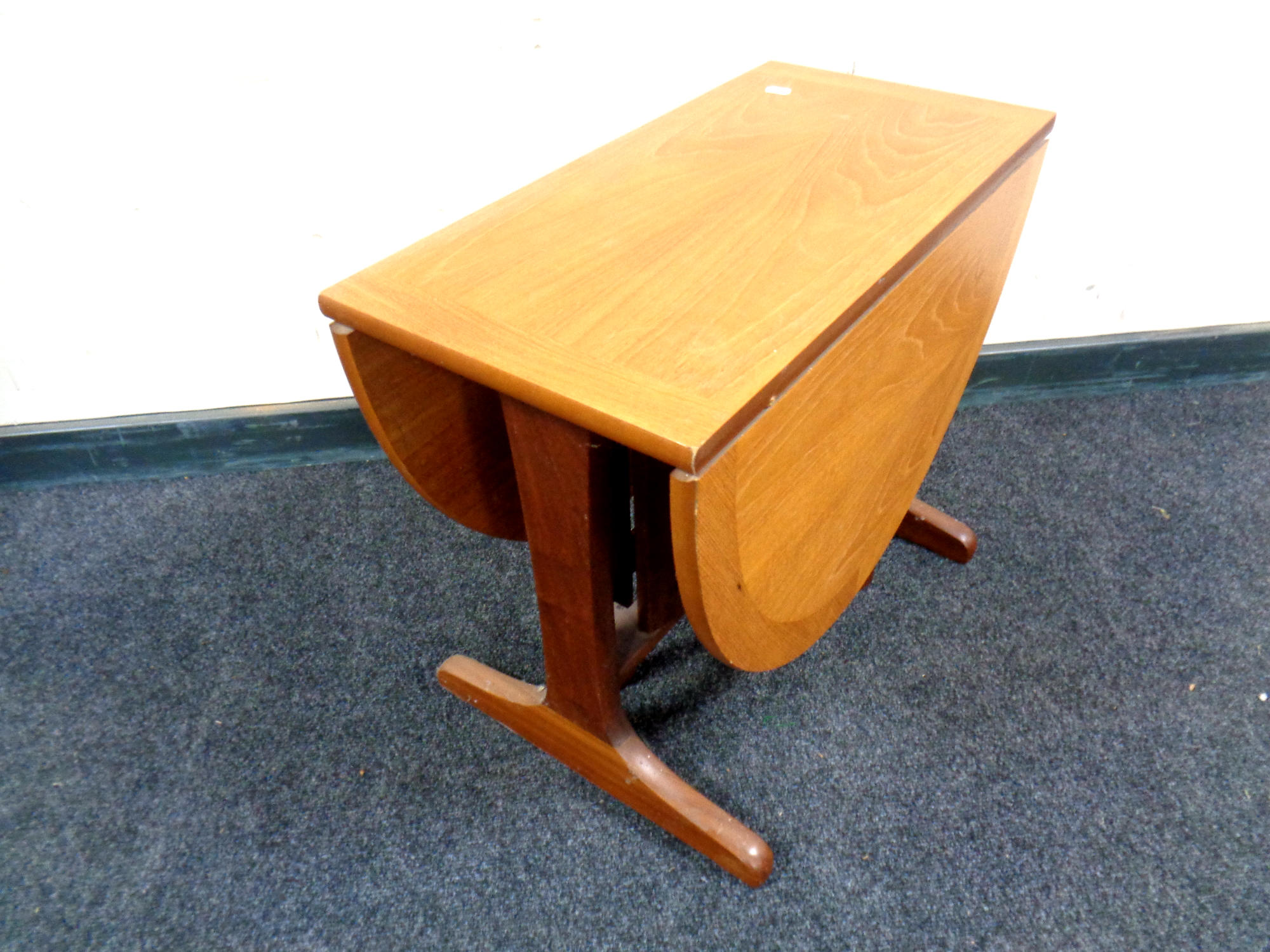 A 20th century Nathan teak drop leaf coffee table