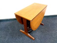 A 20th century Nathan teak drop leaf coffee table