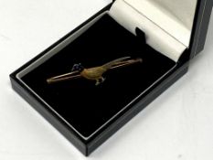 A yellow gold and enamelled pheasant bar brooch by John Grinsell & Sons, 4.1g, width 55 mm.