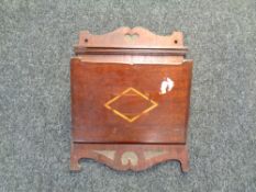 An early 20th century inlaid mahogany newspaper rack