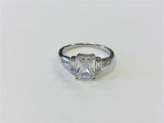 A silver Art Deco style ring set with a clear stone,