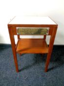 A contemporary teak occasional table with plaque inscribed The Souvenir of The Last Parade and