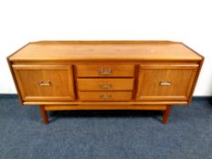 A 20th century teak William Lawrence low sideboard,